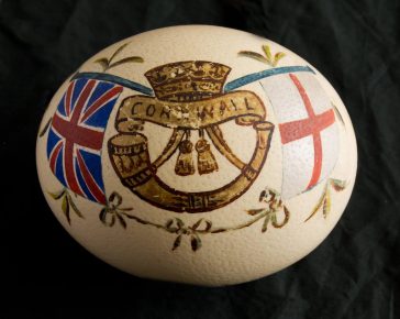 An Ostrich egg painted with the insignia of the Duke of Cornwall's Light Infantry