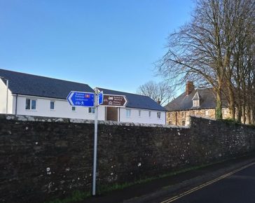 Cornwall's Regimental Museum inside The Keep behind new build houses on the old Parade Ground - 2018