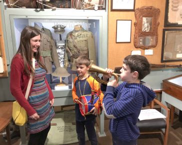 kids playing the instruments in Cornwalls Regimental Museum, Bodmin Keep